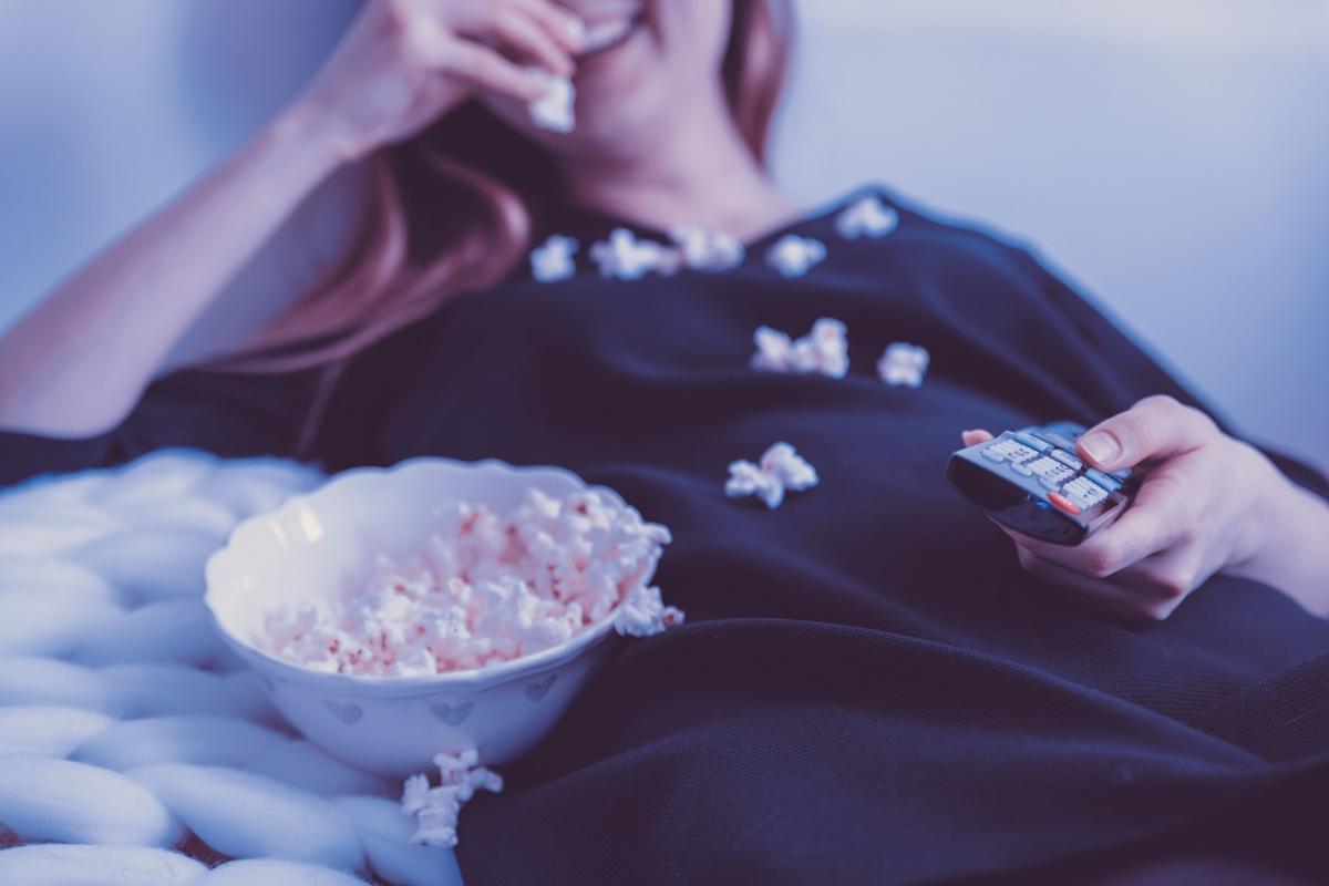 Person with bowl of popcorn