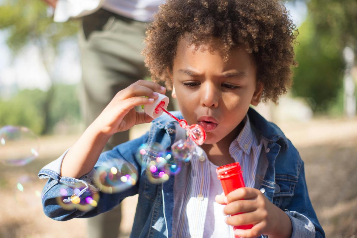 A child blows bubbles.